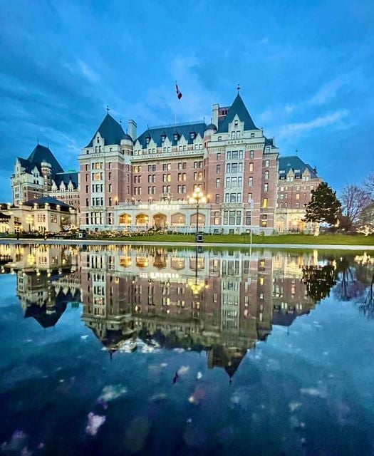 Epic photo of the Empress in Victoria reflected in a rain puddle. { Such a terrific city, and hotel.}