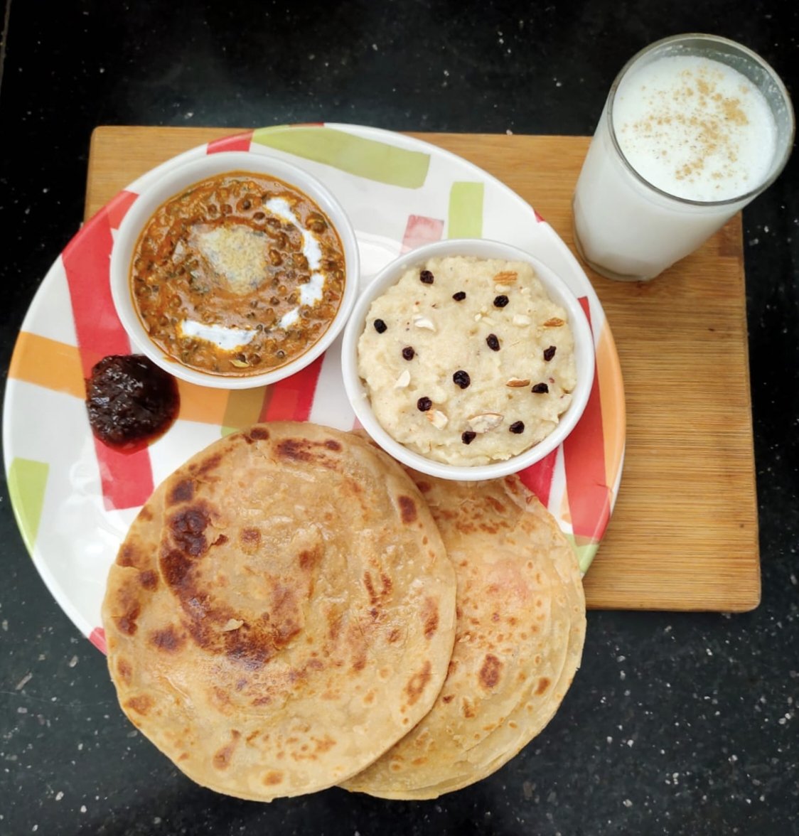 Dal Makhani, Paratha, Payasam garnish with Dried Black Current and  Dryfruits,  Apple Cinnamon Chutney (Himachal Pradesh Spe.) and Butter Milk....