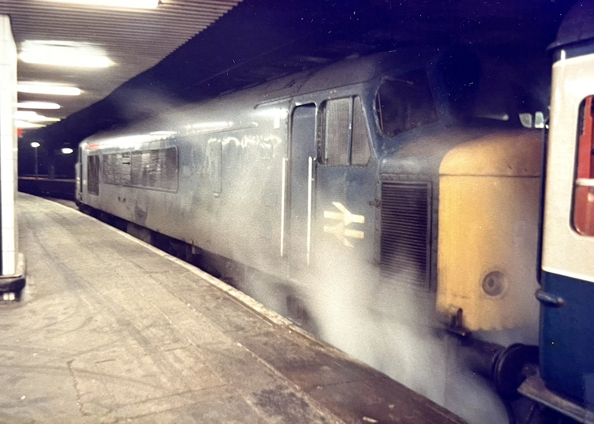 Blast from the Past! You can’t beat a bit of steam heat! Just two months prior to withdrawal due to multiple faults, ‘Peak’ 45048 (formerly ‘Royal Marines’) awaits departure from Birmingham New Street with 2F86 22:20 to Leicester on this day, April 13, 1985. 📷 Roger King.