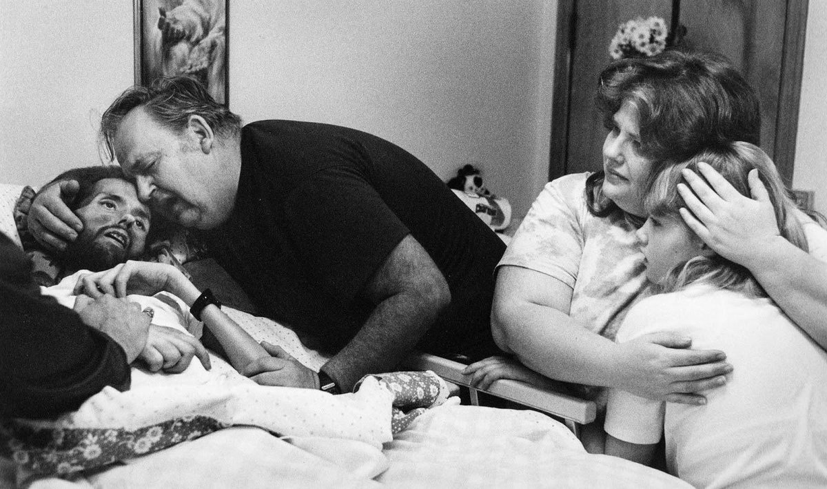The photo that changed the face of the AIDS pandemic—a father comforting his dying son (1989).