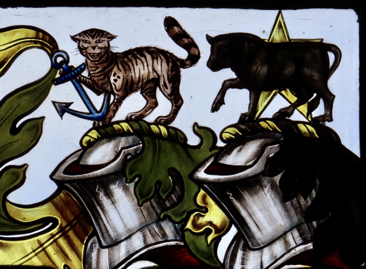 #Caturday
Cat on a hot tin helmet.
With his bovine companion on the crest of Richard Frederic Nevill Aldrich-Blake’s arms. #stainedglass in St Laurence’s, Weston-under-Penyard.