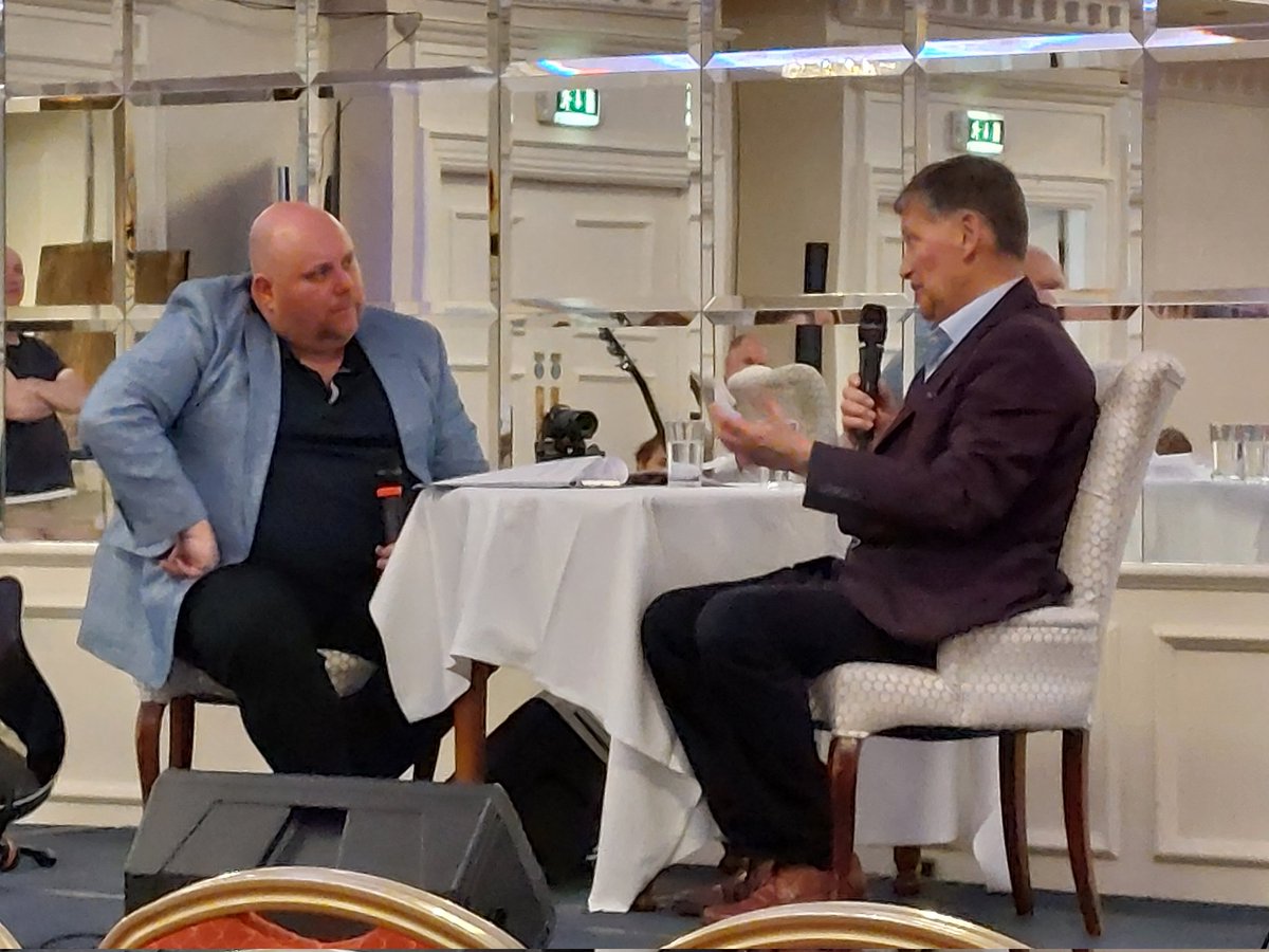 MC John Lynch speaking to John O'Mahony at the Let's Talk About Cancer event in Carrick-on-Shannon