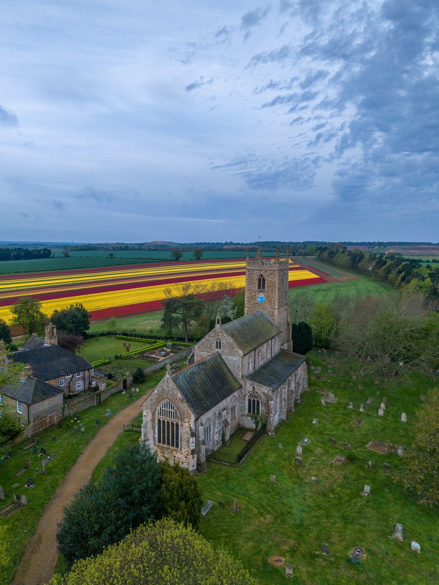 Early morning at All Saints Church in Norfolk today @ElyPhotographic @WeatherAisling @itvweather @StormHour @ThePhotoHour @visitnorfolk #dronephotography #landscapephotography @AP_Magazine #loveukweather #tulips