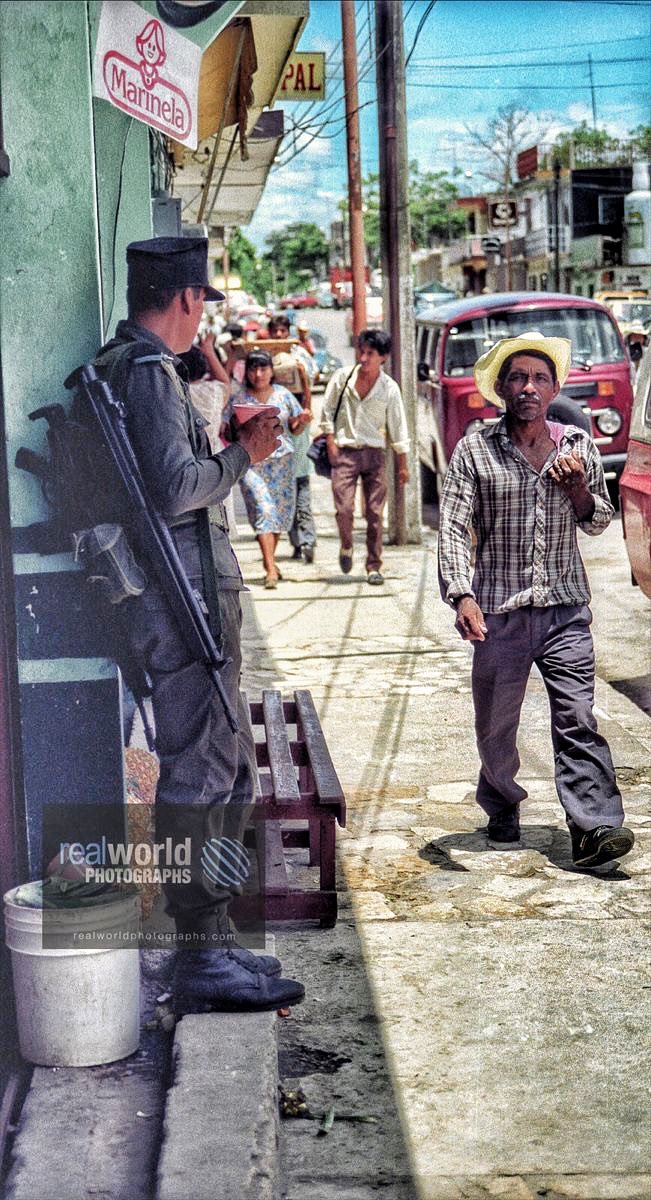 Palenque, Chiapas, Mexico street scene. Gary Moore photo. Real World Photographs. #palenque #mexico #street #soldier #sweden #photojournalism #weather #malmo #skane #garymoore #documentary #liverpool #garymoorephotography #realworldphotographs #nikon #photography #bild