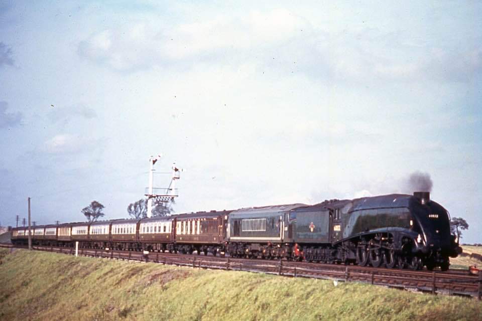 Class A4 60032 Gannet has rescued D179 hauling the up Yorkshire Pullman and train is seen near Corby Glen in October 1962. Colour Rail scan.