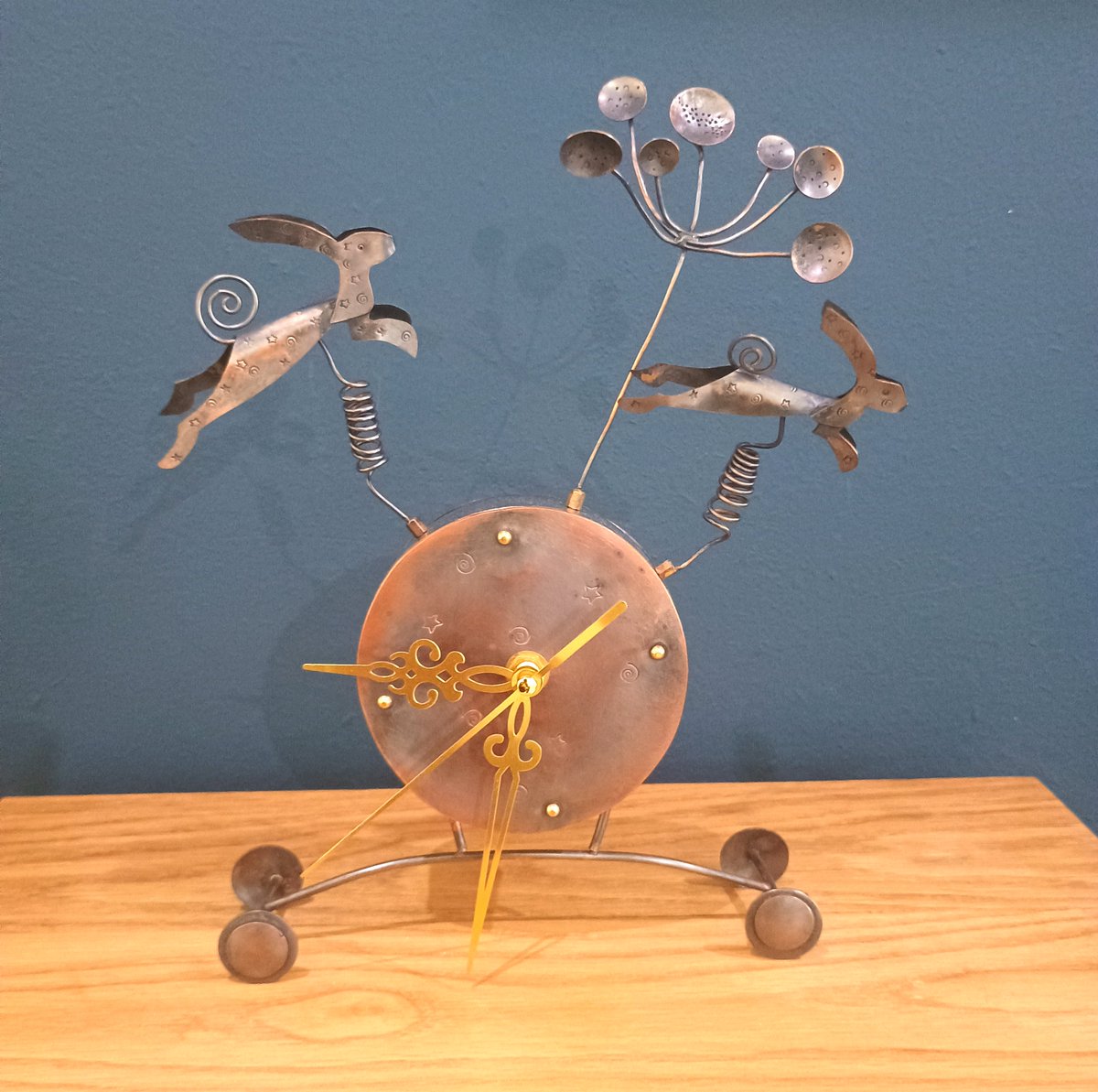 Seed head and hares clock, mixed media by Sara Piper Heap