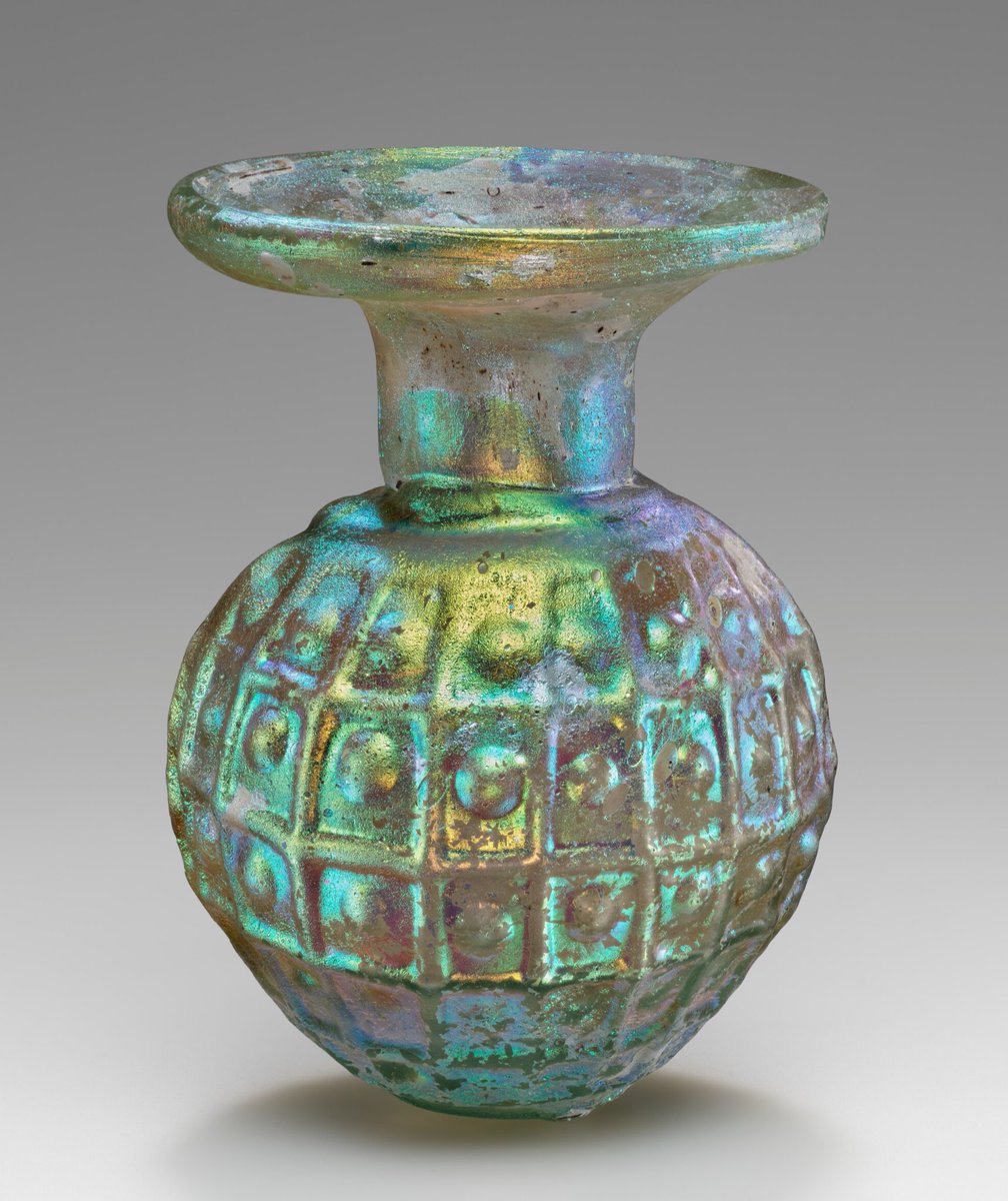 Glass flask ~ C3rd-C4th CE This small flask is only 8.3cm tall but what it lacks in size it makes up for in beauty. The flask is made from light blue glass and has obtained an iridescence from age. It is thought to come from the eastern Mediterranean. 🏛 The Getty