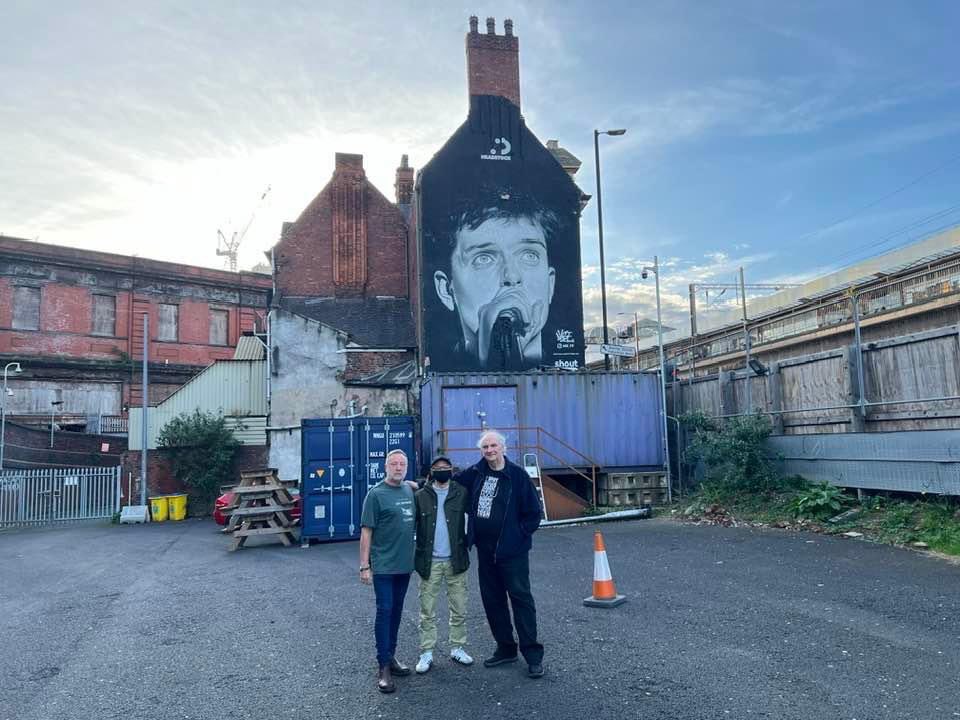 Great night at the @Star_GarterManc last night - here I am before the show with photographer Philippe Carly who took the photo of Ian used for the mural, and the talented artist @Akse_P19 who painted it! Full circle moment…