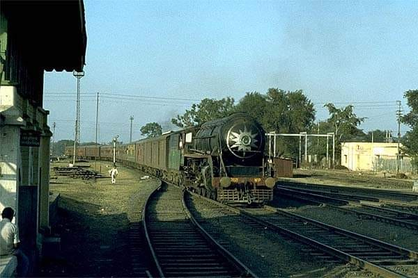 A beautiful photo of Madras Janatha Express being hauled by WP 7021, captured by Terry Case at Nagpur in January 1983! This WP series loco was in a small batch of 30 locos imported from Fablok, a loco manufacturer based in Chrzanów, Poland, in 1958-59. <a href="/SachinKalbag/">Sachin Kalbag</a> <a href="/somnath1978/">Somnath Mukherjee</a>