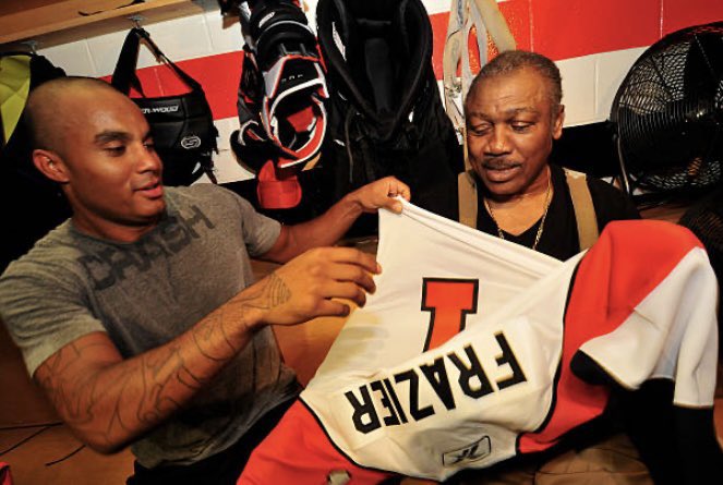 Goaltender Ray Emery of the Philadelphia Flyers presented former Heavyweight boxing champion Joe Frazier with his own Flyers jersey. #RayEmery #PhiladelphiaFlyers #Philadelphia #Flyers #hockey #JoeFrazier #boxing #sports