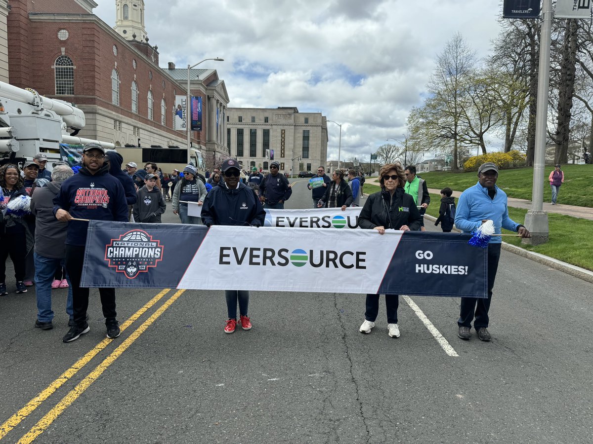 #GOHUSKIES! It’s time to celebrate our @NCAA National Champs! We’re in downtown Hartford to walk in the @uconnmbb Victory Parade alongside our Electric Operations Supervisor Bill Clingan, proud dad of 🏀 ⭐ Donavan Clingan. #EVERYTHING #BleedBlue 🏆🏆🏆🏆🏆