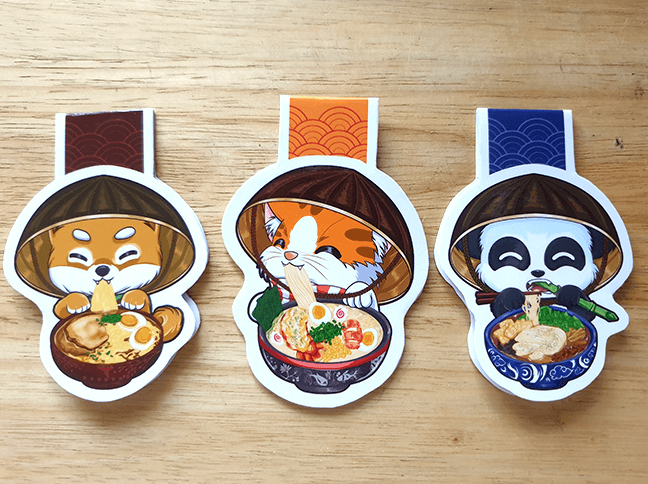 timelaxcreation's tweet photo. Added my latest art of our orange tabby in my ramen series! Available now as cute magnetic bookmarks for readers out there! Visit our online store and get yours now! https://t.co/TbDoiPRd82
