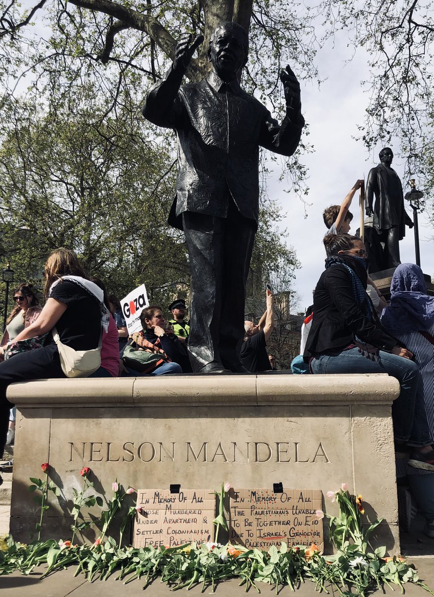 Palestine solidarity protesters in London are laying flowers at the statue of Nelson Mandela, “in memory of all those murdered under apartheid and settler colonialism”.