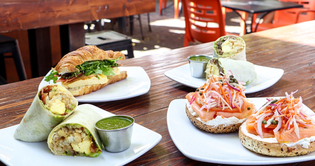 Breakfast till noon every day! 🍳 The best breakfast burritos, lox, avo toast + more to pair with a handcrafted latte or mimosa. ☕️ 🍴 🥂