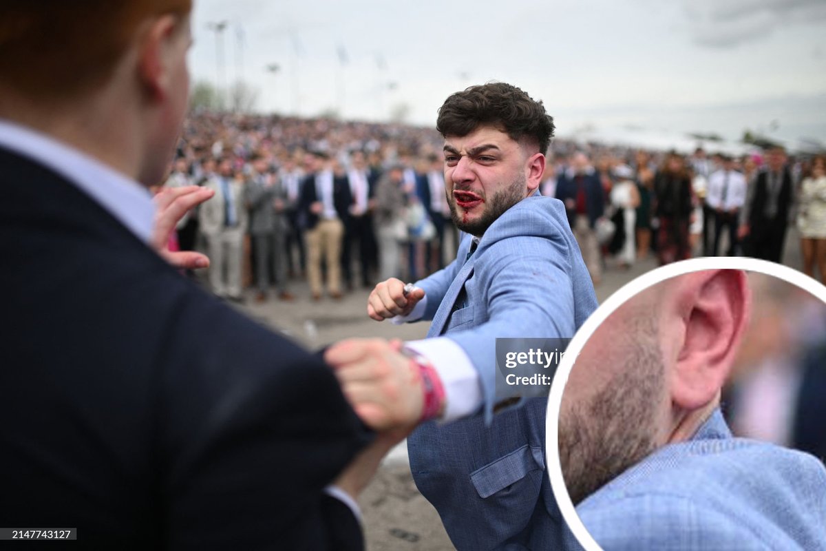 when buying a suit, hold the sales associate like this, cock back your fist, and then look for a collar gap while saying 'the menswear guy told me to do this'