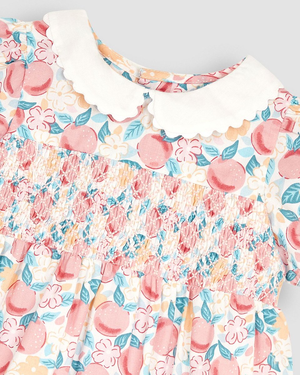 Welcome sunny days with open arms in this tiny, and very fruity, smocked dress 🍑 bit.ly/3vQibRM