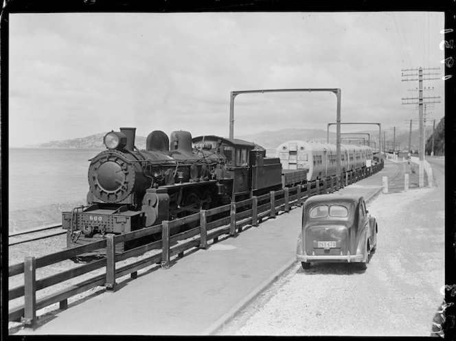 An A class locomotive towing multi-unit train coaches for the Hutt Valley electrical rail. Photograph taken circa 12 February 1951. Source: National Library of NZ. natlib.govt.nz/records/230229…