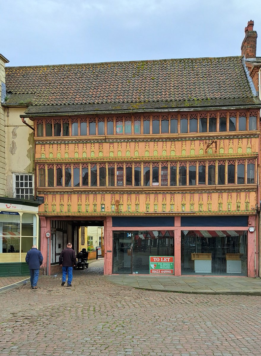 Fancy living in an early 14th-century old inn (rear) with front from 1470 featuring little figures under crocketed canopies? The old White Hart, Market Place, Newark, is to let.