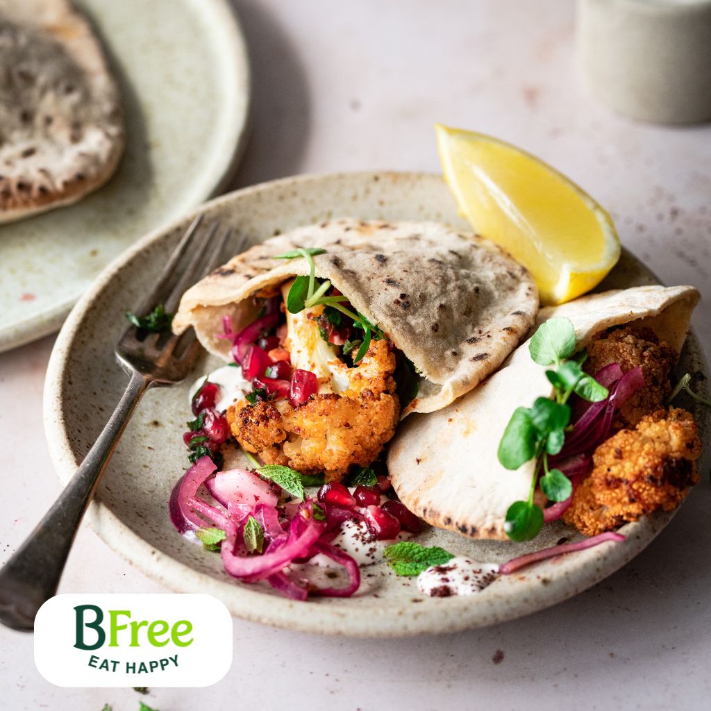 Travel to the Middle East with this gluten-free Cauliflower Pitta recipe. Exotic spices and marinated cauliflower flooded with rich tahini and mint coriander sauce. @Bfree stone baked pitta work wonderfully in this recipe. celiac.ca/bfree-new-prod…