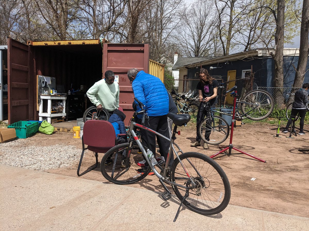 DFANewHaven's tweet photo. Over 100 people showed up this morning to the pop-up bike repair clinic at the Bike Box at the Newhallville Learning Corridor, the youngest at 5 years old and the oldest (a retired New Haven firefighter pictured here) was 72. https://t.co/LlfNtfvqSY