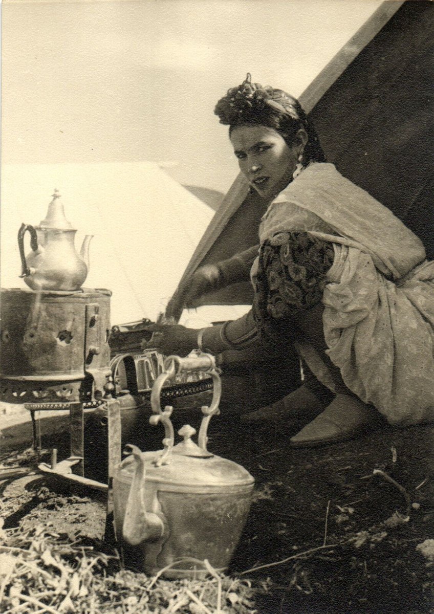 Moroccan Amazigh woman preparing tea. (French vintage postcard)