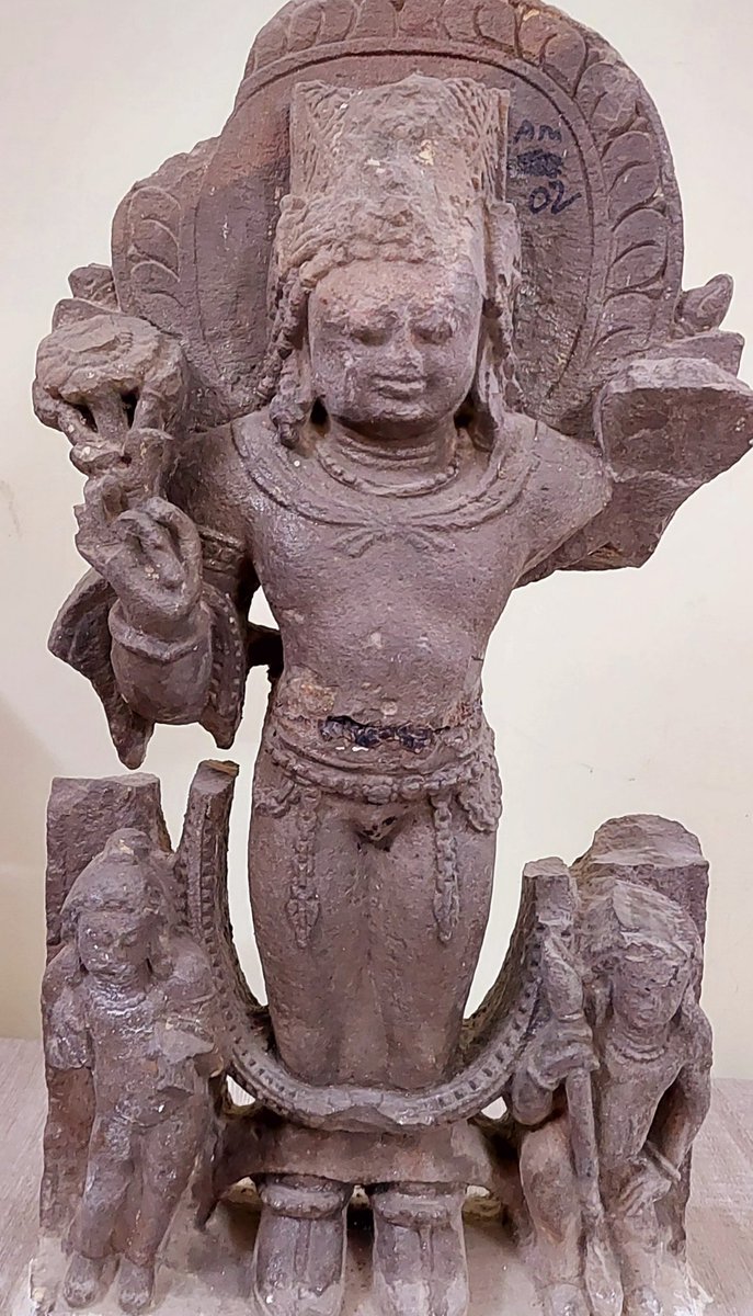 #Sculpture Dvibhuja Surya सूर्य. Sun disk on back side and lotus पद्म in one hand visible. • Place : Mt. Abu Museum (#Rajasthan) Found from अचलगढ • Antiquity : 8th century (~1200 yrs) • Material : Sandstone Perhaps one of the earliest such sculpture from this region.