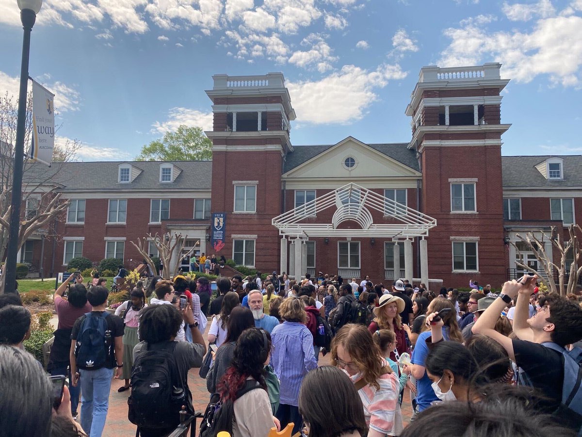 UNCGSO's tweet photo. Students gathered for a historical moment during the eclipse viewing, despite the astronomy department's program being cut by the Chancellor and Provost - something @UNCG didn't show you. Thank you, Dr. Aarnio for an incredible experience https://t.co/J5teVCjugl