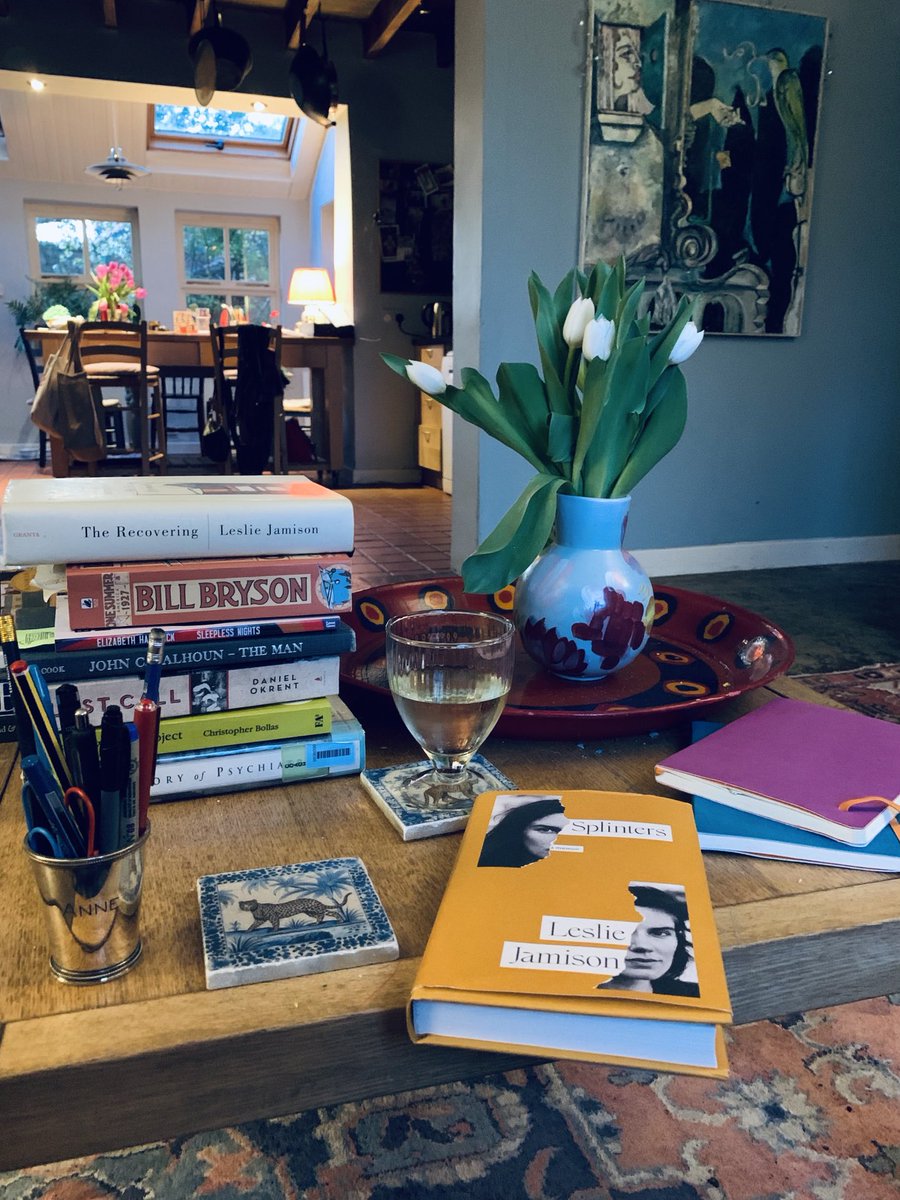 Tulips, wine, books for researching mental illness and addiction in my family, & Leslie Jamison’s latest book (and an earlier one of hers on the stack, just above ⁦Bill Bryson’s book which mentions my grandfather’s death from alcohol). ⁦@lsjamison⁩ ⁦@billbrysonn⁩