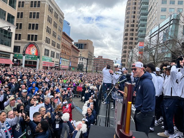 Coach Dan Hurley & NCAA Men’s Basketball Champion UConn Huskies share joy & pride with more than 50K fans—talking 3-peat! A very special day.