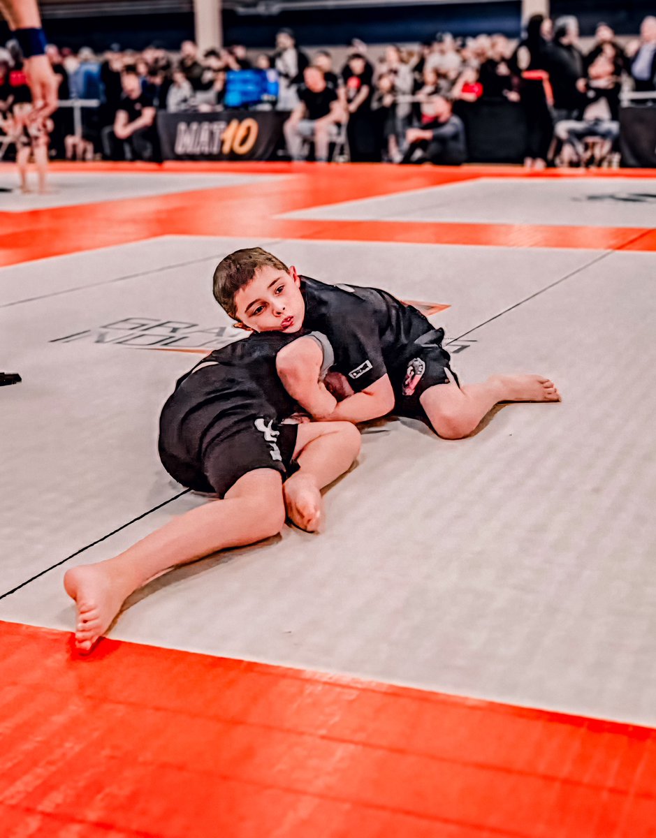 CaliberJiuJitsu's tweet photo. Competition day brings Caliber’s lessons into focus—every match a quiet testament to growth and resilience. 
.
Here, our athletes show the depth of their training, their strength not just in victories but in the courage to compete. 
.
#CaliberBJJ https://t.co/T18kp4NrLA