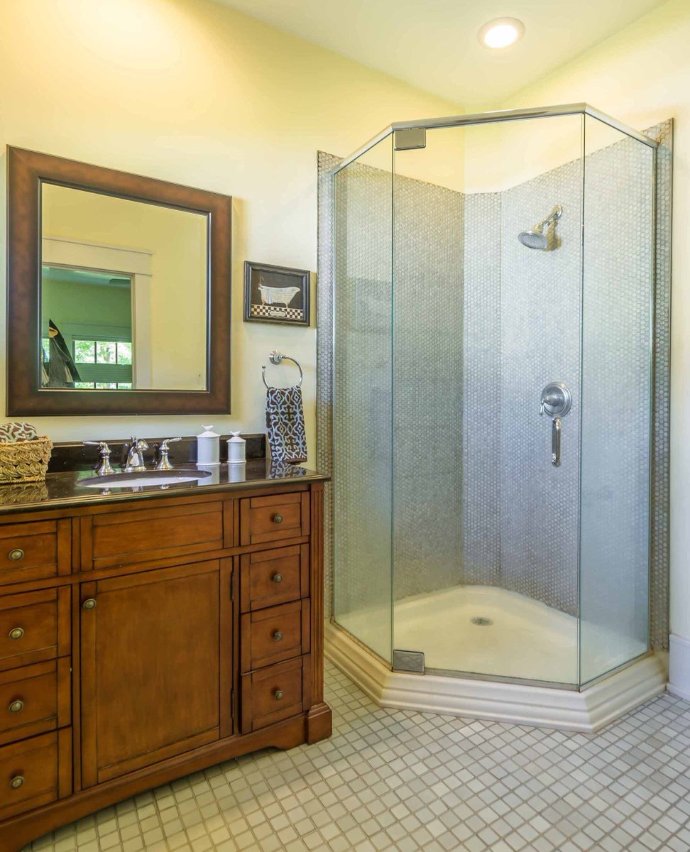 Craftsman homes are known for their natural materials, expert craftsmanship, and warm, inviting feel. But don't be fooled by its classic look; this bathroom boasts modern amenities for ultimate comfort and convenience.

#EveryDesignTellsAStory #LetUsTellYourStory #1212Architects