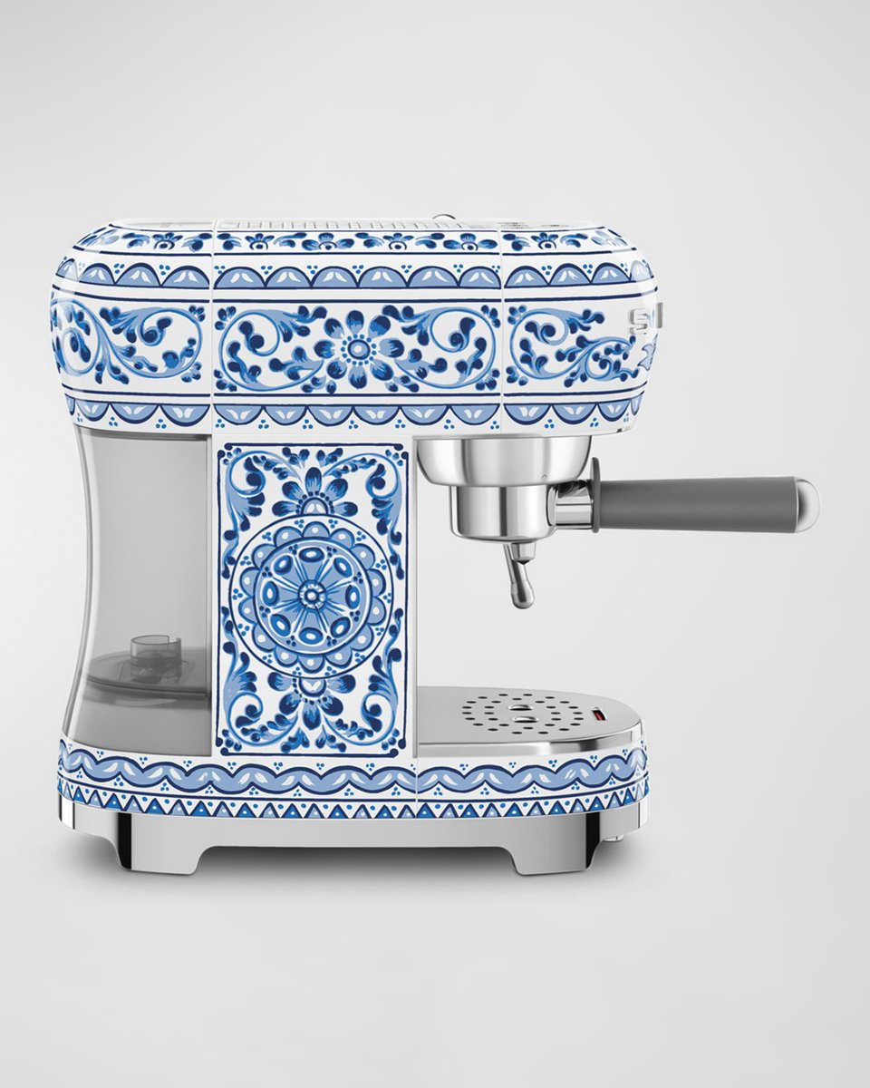 A Docle & Gabana branded espresso machine by Smeg, yes the company is called Smeg and how fitting a partnership. Also the coffee maker looks like old porcelain tiles which is a choice. neimanmarcus.com/p/smeg-x-dolce…