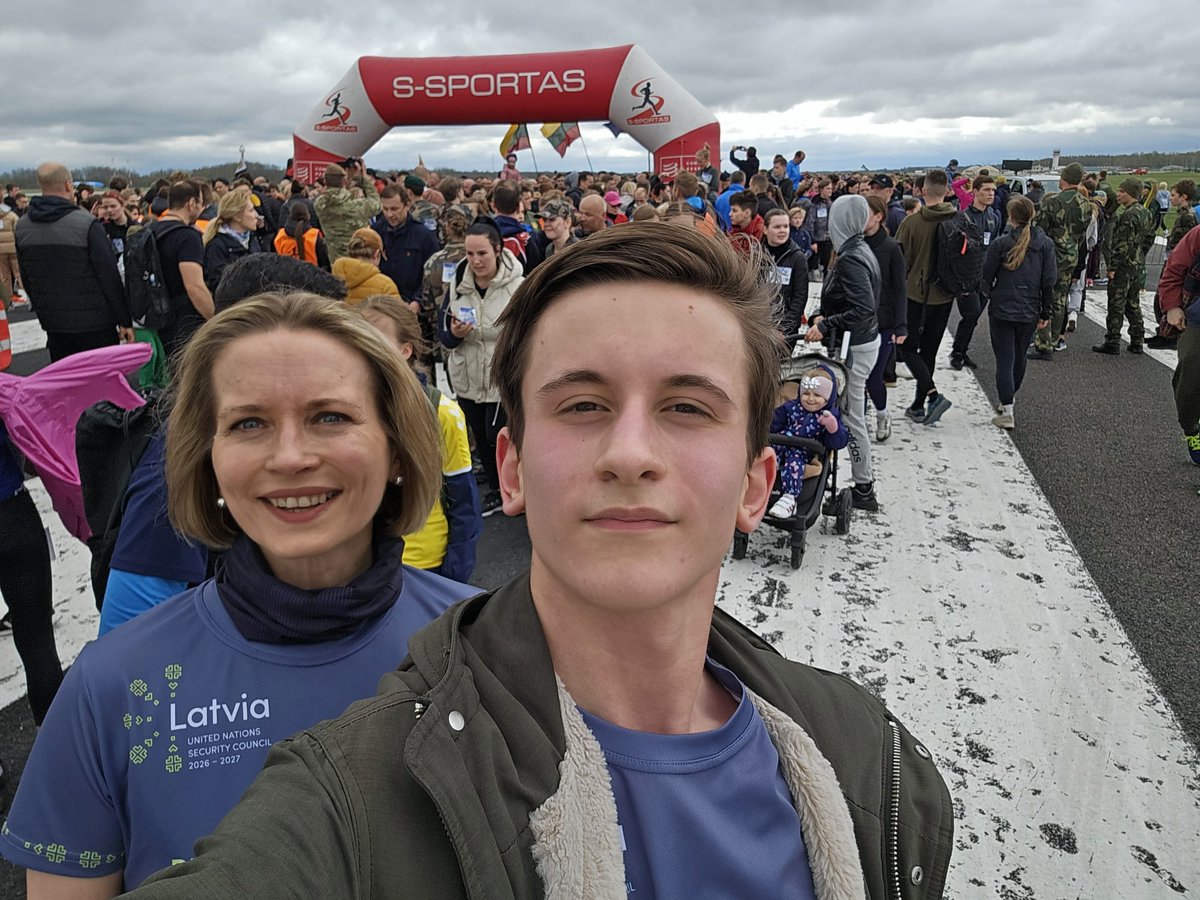 Huge international turnout at 10th annual Runway Run at #Siauliai Airport - 3km of high energy marking 🇱🇹 20 years in #NATO. Karlis & I in 🇱🇻 #LatviaUNSC gear, running for peace and resilience.  Great teamwork between city council & armed forces.