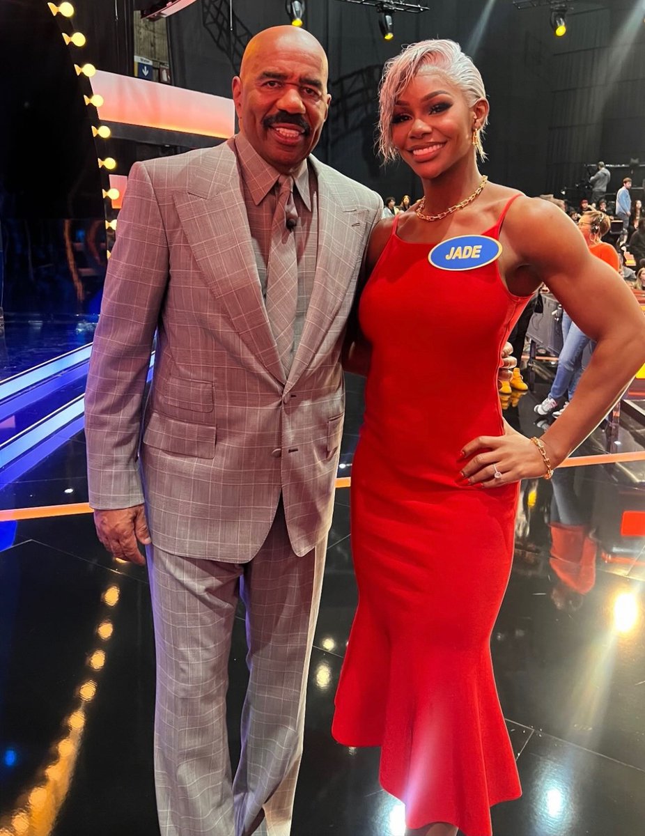 Jade Cargill posing with Steve Harvey during recent taping for Celebrity Family Feud