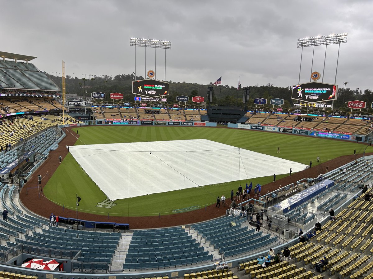THEREAL_DV's tweet photo. Dodger Stadium has seen the tarp more to start 2024 than it has in the previous 60 years. 🌧️ https://t.co/Almd7DvkoZ