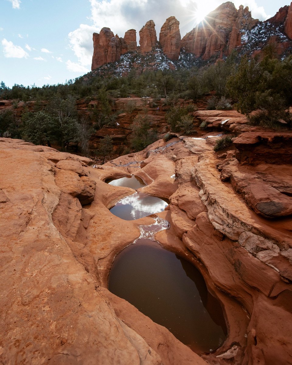 Known for its cultural history and significance, the Seven Sacred Pools Trail is a 1.1 mile adventure that shows off views of sandstone pillars and bodies of water that give the trail its name. bit.ly/4aBE6uL 📸 @hikewithjen 📍Seven Sacred Pools Trail, Arizona