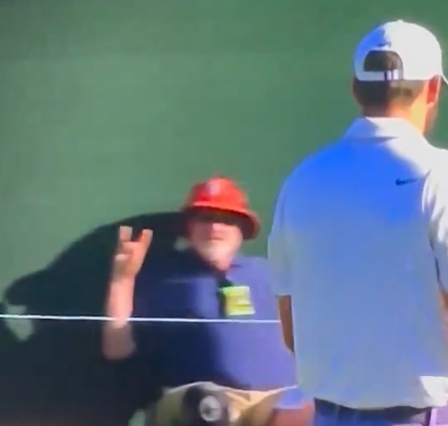 Shoutout to the NC State fan throwing up the wolf symbol at the Masters.
