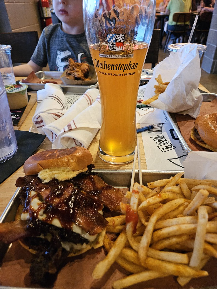 Double brisket smash burger with bacon from @MeatMitch & beer from the @weihenstephan. The oldest brewery in the world, founded in 1040. 🤤