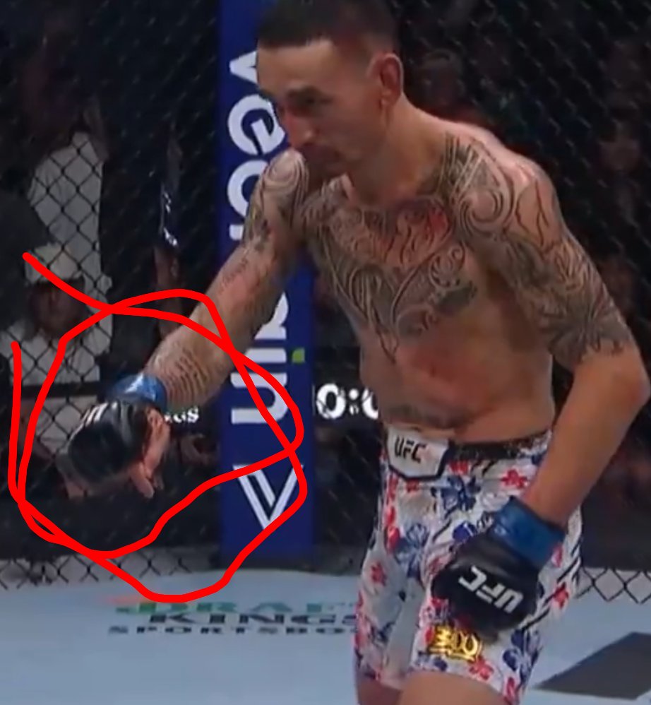 Fixed fight? You can see Holloway give him the signal to fall before the 'knockout' happens