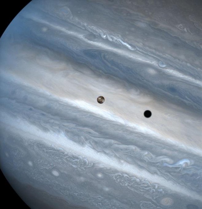 Jupiter's moon Io eclipsing the Sun. Io is roughly the size of Earth's moon Hubble