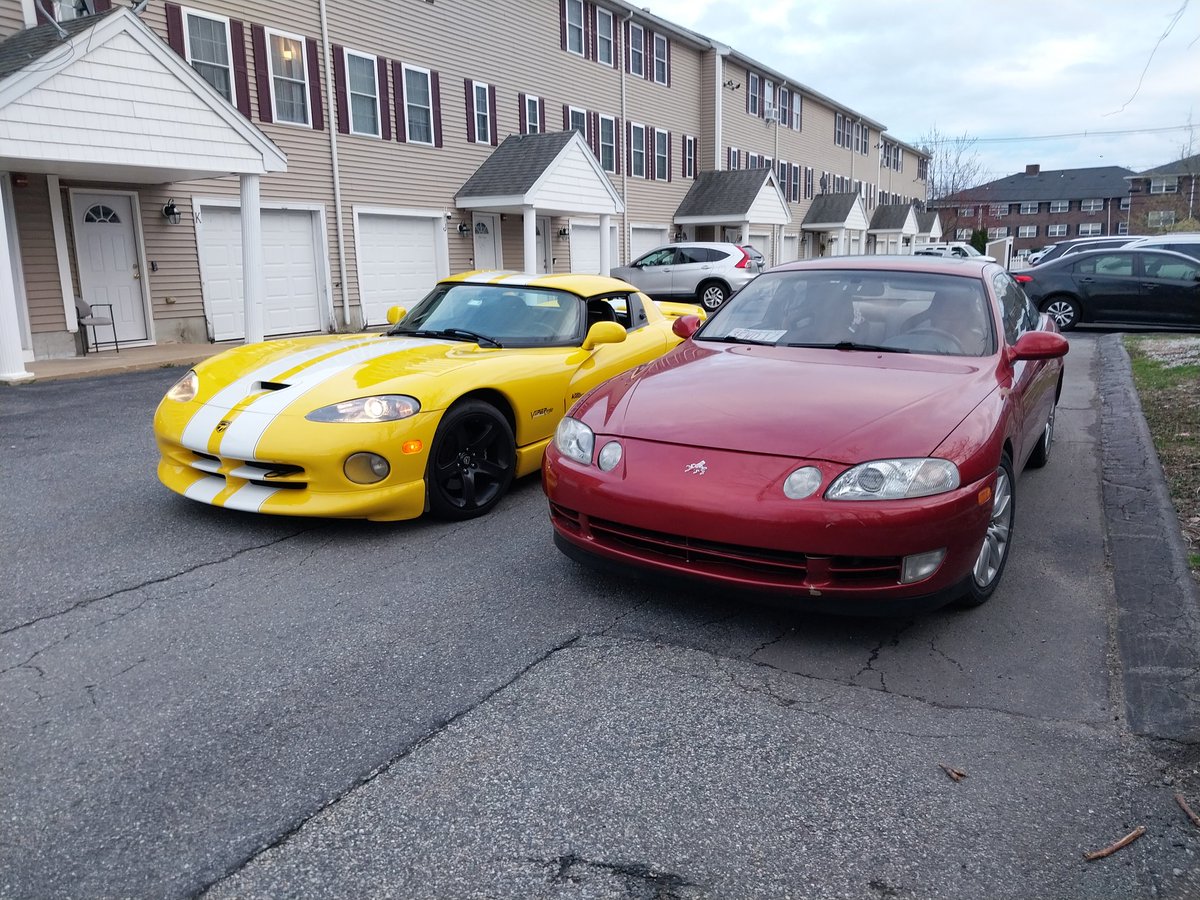 Some old Toyota and a Miata