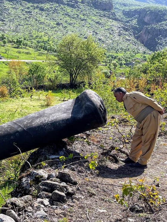 Kurdish man in Rawanduz of Iraqi #Kurdistan carefully examining remnant of an #Iranian missile intercepted en route to #Israel as it passed above his village.