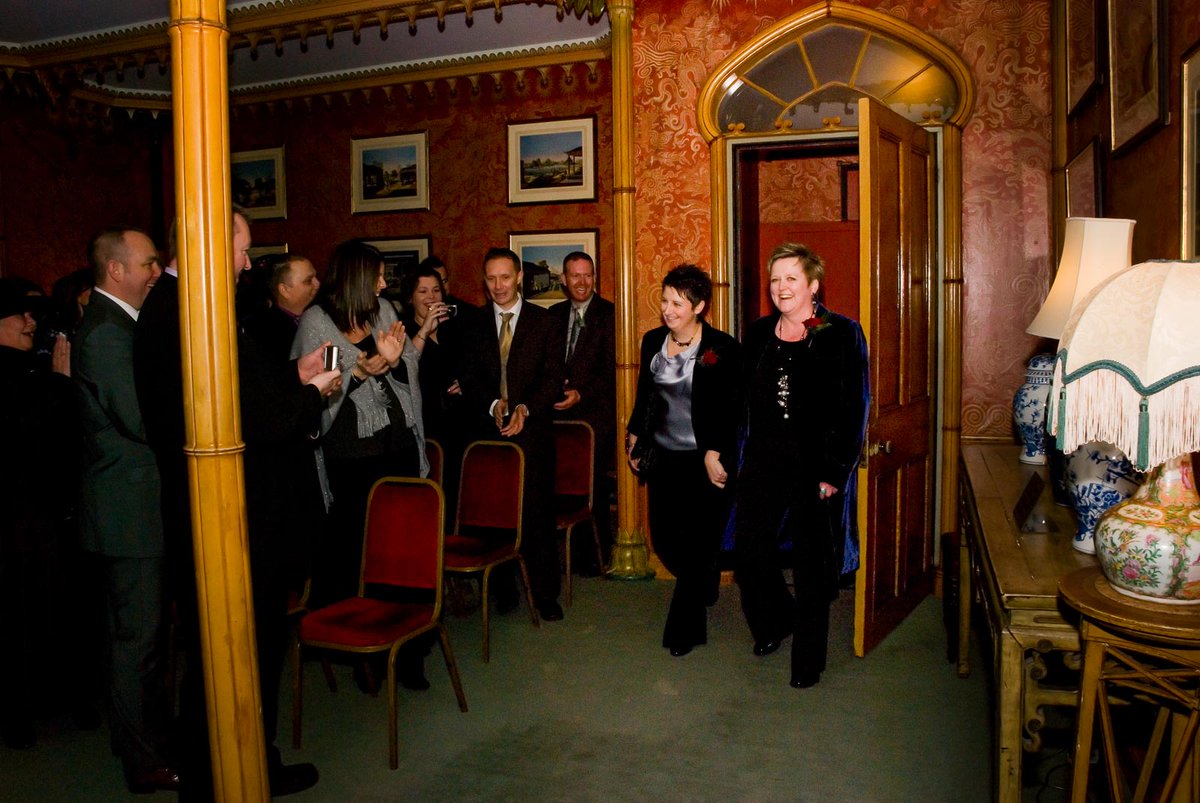 Laura and Paula enter the ceremony room at @brightonmuseums on front of friends and family before their #CivilPartnership. #brightonweddingphotographer See more - lewesweddingphotographer.com/russ-meg-weddi…