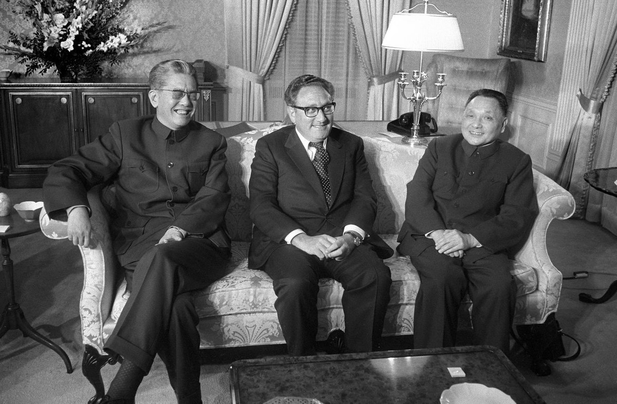 Chinese Foreign Minister Chiao Kuan-Hua, U.S. Secretary of State Henry Kissinger, and Chinese Vice Premier Deng Xiaoping during a dinner at the Waldorf Astoria hotel in New York City.