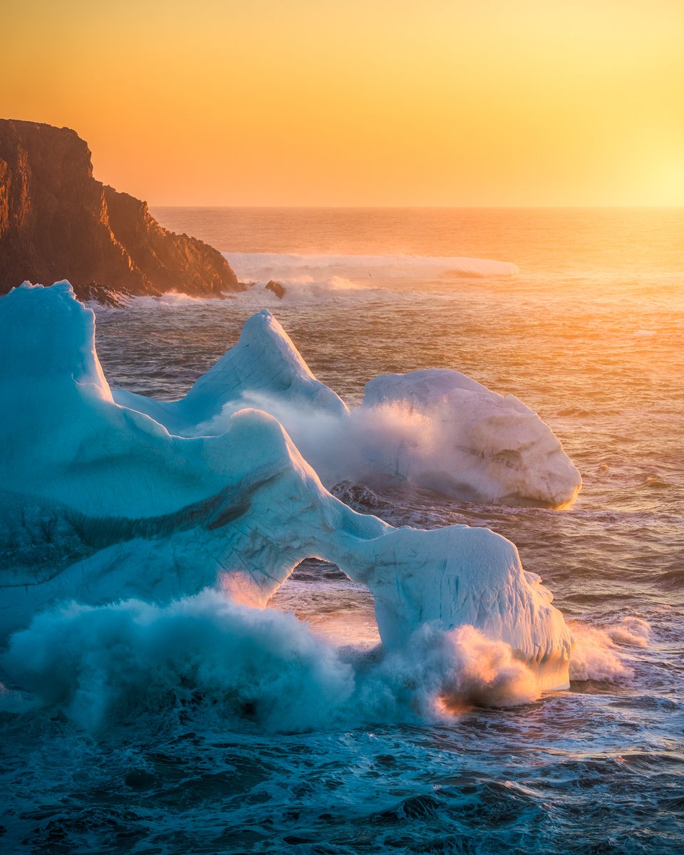 It was quite a view as the sun began to hit the horizon gently colouring an iceberg with oranges and yellows. With plenty of atmosphere in the air it created an otherworldly scene. It was exciting to watch this unfold as the waves crashed against the iceberg below at Twillingate…