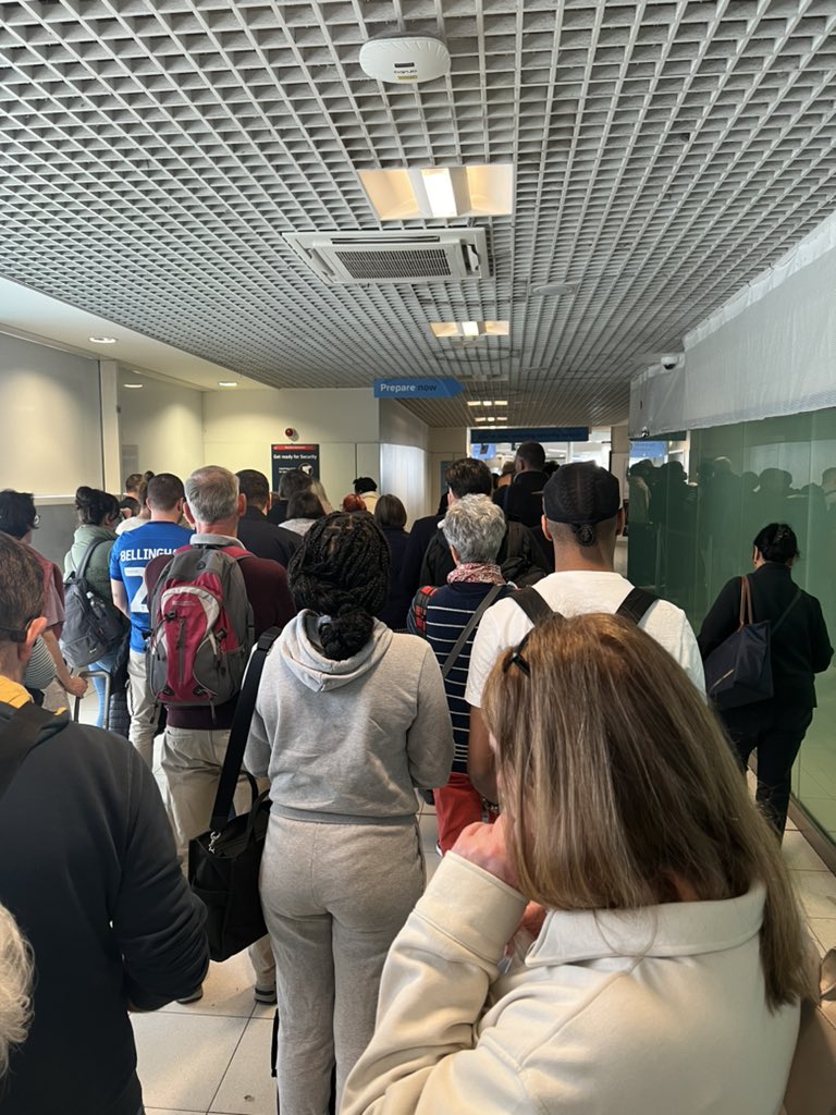DaisyHepp's tweet photo. @bhx_official what a shitshow you call yourself an international airport. You are a joke. Been at the airport for 2 hours now and not even made it to security. #joke https://t.co/NvO8DCDQiZ