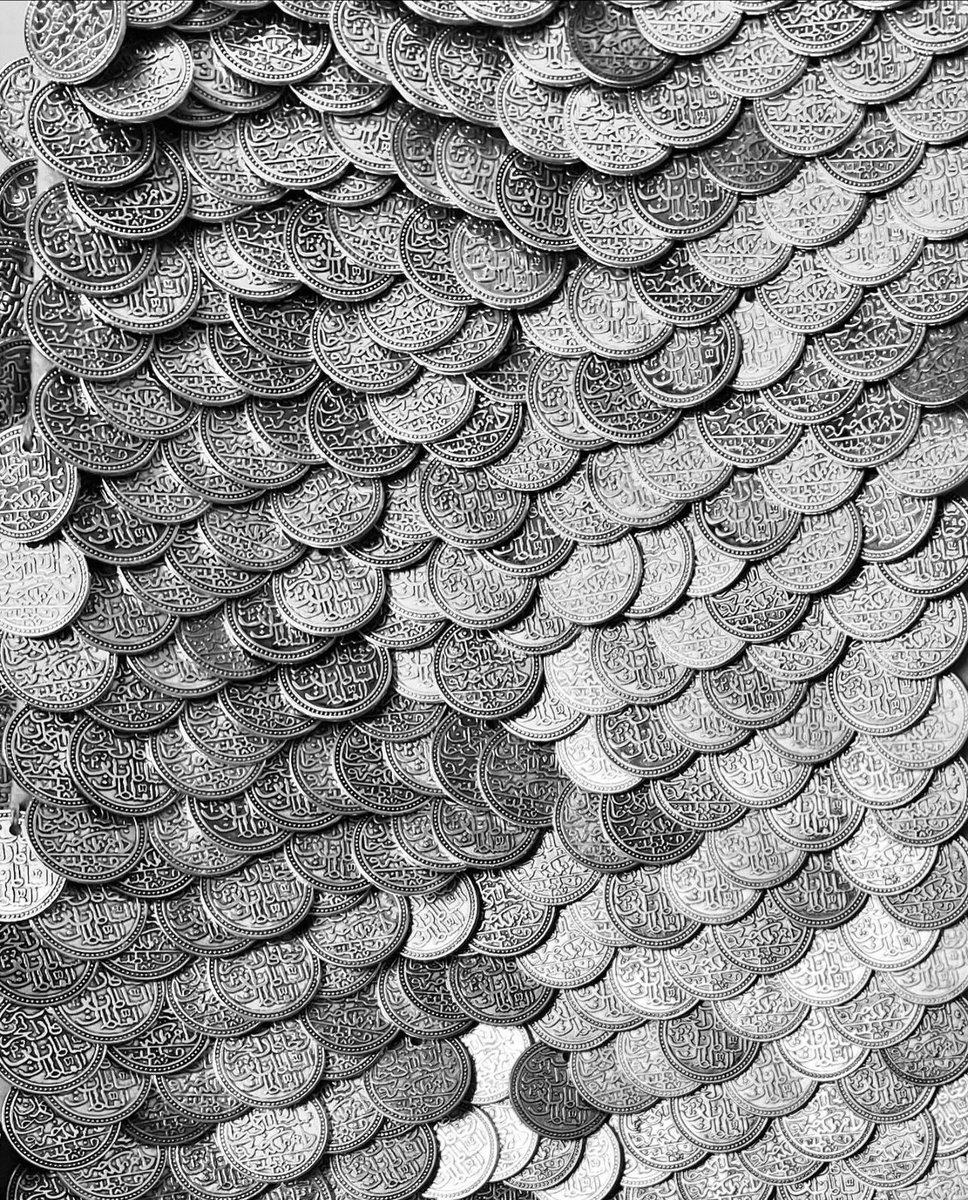 by nazzal studio, comprised of 10,000 Palestinian coins hand sewn by refugee women.