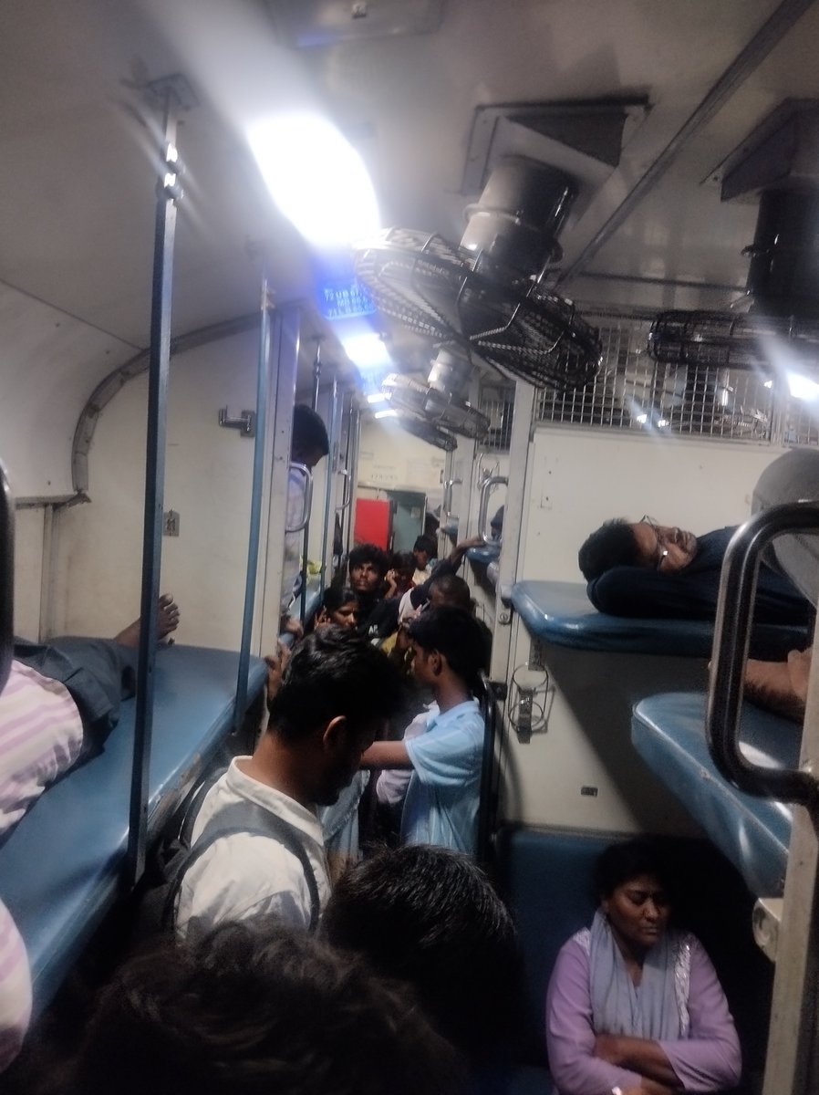 dew_ansh's tweet photo. @AshwiniVaishnaw @RailMinIndia why are we paying for reservations in train if there is no difference in reserved and general class. What about safety when 3 people are sleeping on ground near luggage

This is photo from 16594 right now, can't even go to toilet https://t.co/ziTXyk1Cm4