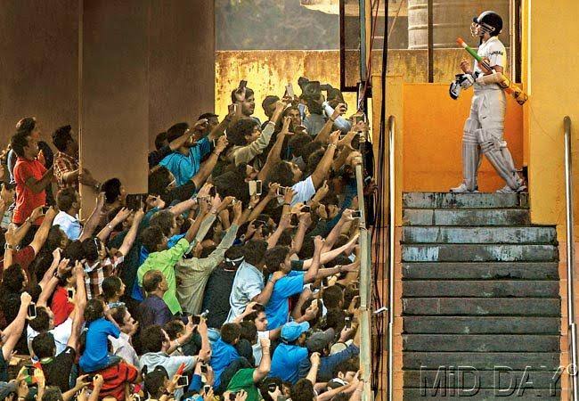 Two iconic pictures both at Wankhede. The Sachin one is by Atul Kamble of Mid Day from his retirement in 2013.