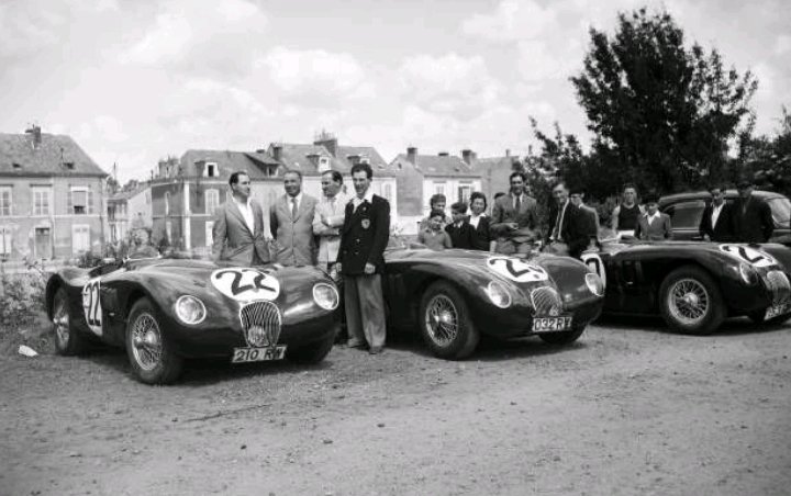 1951 Center of #lemans during the administrative and technical checks. Jaguar drivers (from Left to Right: Jack Fairman 🇬🇧 Climente Biondetti 🇮🇹 Leslie Johanson 🇬🇧 Stirling Moss 🇬🇧 Peter Walker 🇬🇧 Peter Whitehead 🇬🇧 Pose in front of their Jaguar XK120 C cars. #classic #race